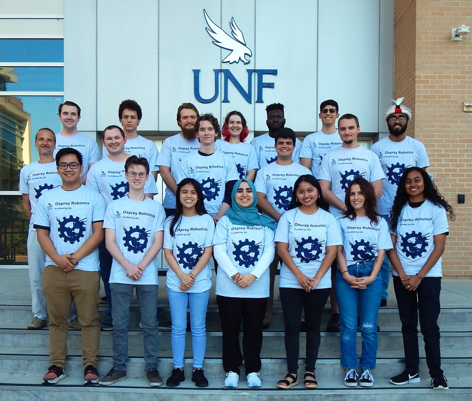 2022 UNF Osprey Student Robotics Club Photo 1, Nathan next to Dr Kriedl
