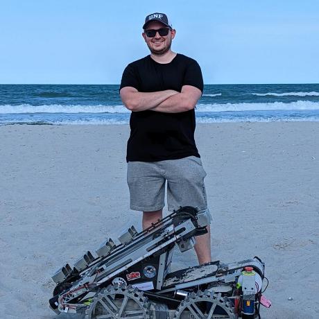 2025 Nathan Nye Github Profile Photo with 2022 UNF NASA Robot